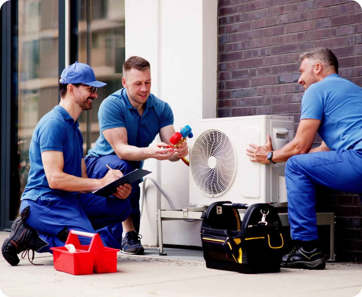 Technicians installing outdoor air conditioning.